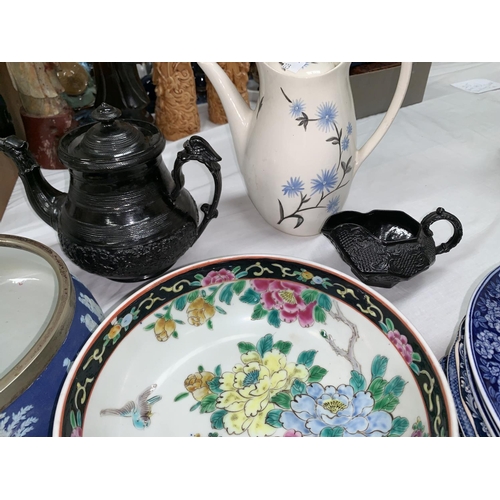223 - A Wedgwood blue jasperware bowl; a 19th century black stoneware teapot and jug; an Abbey blue  white... 