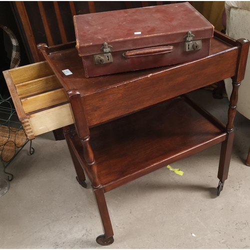 513 - A 1930's 2 tier tea trolley with cutlery drawer; a small leather case