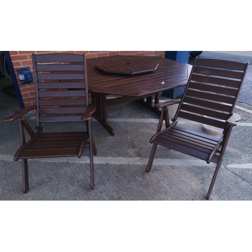 588a - An Australian hardwood garden suite comprising octagonal table and 8 chairs, by Clarecraft