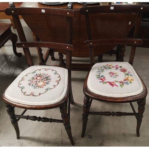 602A - Two early 20th century rustic bedroom chairs with embroidered seats