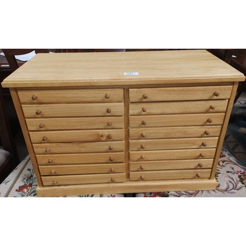 641 - A modern wooden collectors cabinet of 18 drawers