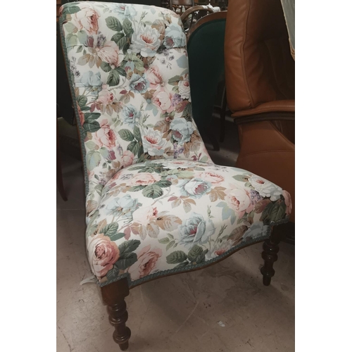 653 - A Voctorian mahogany nursing chair in floral upholstery