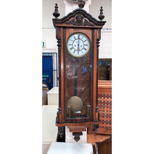 391 - A 19th century walnut Vienna wall clock with ebonised and turned mouldings etc, white dial and doubl... 