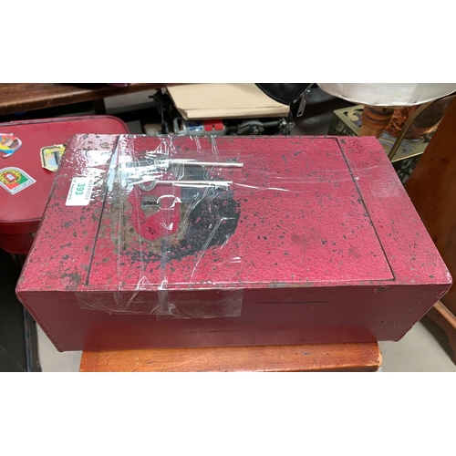 393 - A cast metal strong box with key
