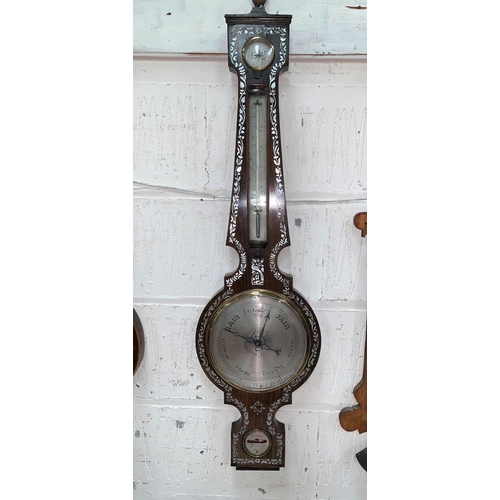 405A - An early 19th Century mercury column barometer in banjo shaped rosewood case with
extensive mother o... 