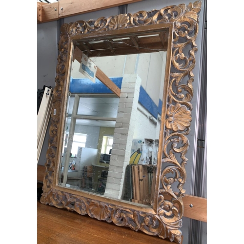 639 - A large bevelled mirror in ornate Florentine carved frame (mirror glass a.f.); 2 large picture frame... 