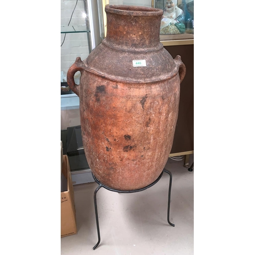 446a - A large terracotta Grecian style amphora on stand (rim chipped)