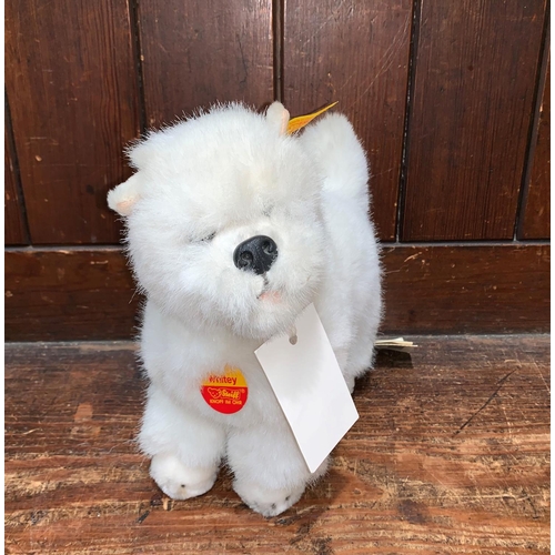 452A - A modern Steiff “Whitey” West Highland terrier with original ear button and paper label,
length 9”