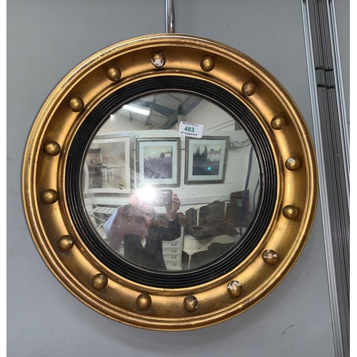 483 - A convex circular wall mirror in gilt ball frame