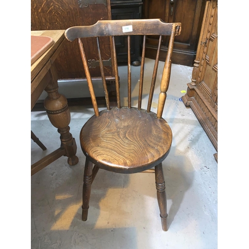 516 - A set of 4 elm stick back kitchen chairs