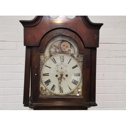 663 - An early 19th century mahogany longcase clock with arched painted dial and 8 day movement