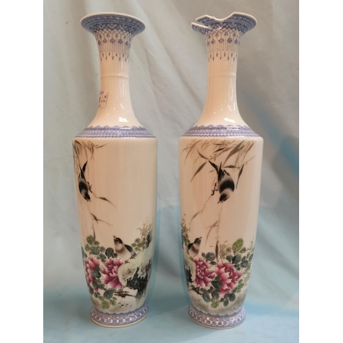 240 - A Chinese Republic pair of slender tapering vases decorated in the famille rose manner with birds an... 