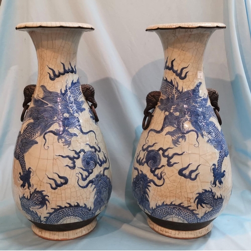 258d - A Chinese pair of large crackle glaze vases decorated in blue with dragons, impressed seal to bases,... 