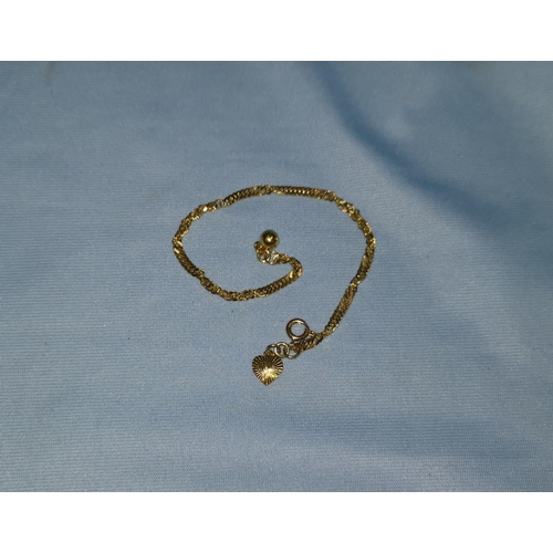 338 - A yellow metal wrist chain, tests as 18 ct, 4.7 gm