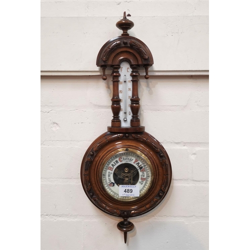 489 - A late 19th century barometer/thermometer in banjo shaped case, 46 cm