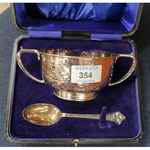 354 - An Arts & Crafts silver porringer and spoon with planished decoration, Birmingham 1927, boxed