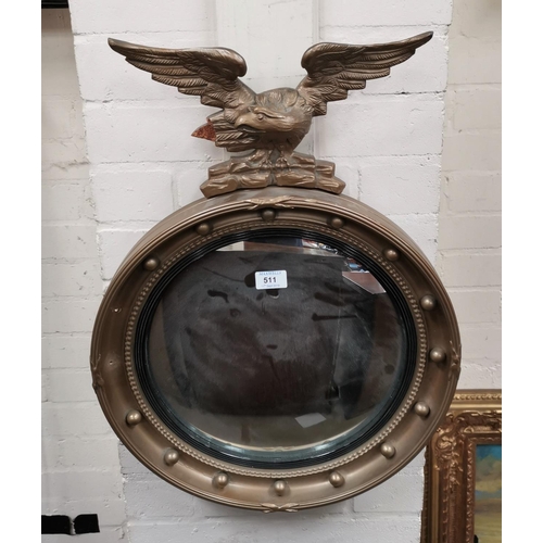 511 - An Edwardian convex wall mirror in gilt eagle and ball frame; a barometer in gilt case; a brass temp... 