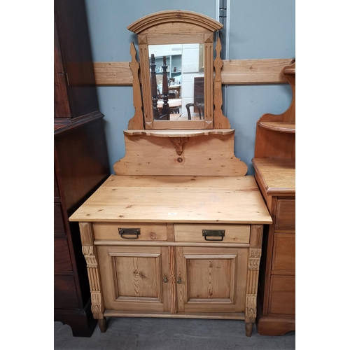 543 - An Edwardian stripped pine dressing table with 2 drawers and double cupboard