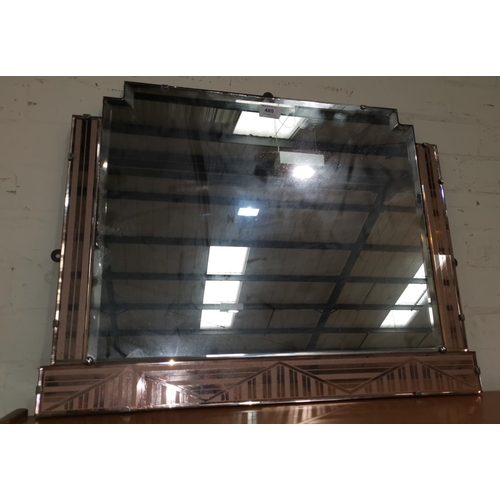 485 - An Art Deco bevelled glass mirror, bordered on 3 sides with frosted peach glass panels with geometri... 