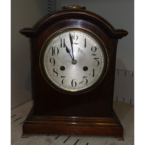 523 - A 1920's Georgian style bracket clock with striking movement, brass ogee feet and handle