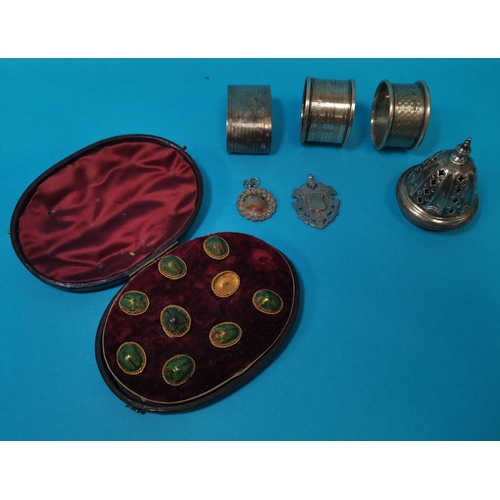 348 - Three silver napkin rings; a sifter top; 2 fob medals; a set of cuulinks and studs in the form of sc... 