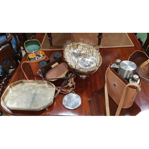 356 - A silver circular coaster, London c. 1980, 4.5 oz; a silver plated bowl fitted with shot glasses and... 