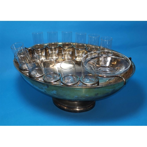 356 - A silver circular coaster, London c. 1980, 4.5 oz; a silver plated bowl fitted with shot glasses and... 