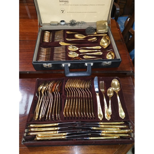 358 - A gold plated canteen of cutlery in fitted case; 2 1930's marcasite brooches; a gilt compact with li... 