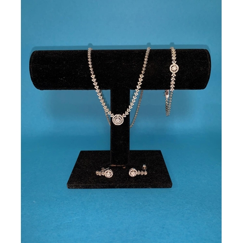 329 - A modern white gold and diamond suite of necklace, bracelet and earrings, the necklace with central ... 