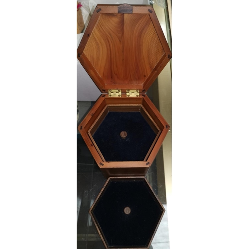 490 - A solid yew wood hexagonal jewellery box fitted 2 trays, height 13 cm