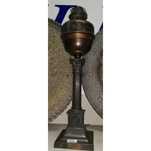 506 - An early 20th century Corinthian column oil lamp in anodised metal, 24