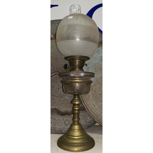 507 - A 19th century brass oil lamp with cut glass reservoir, frosted shade and chimney, 22