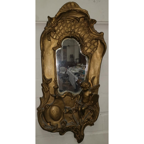 514 - An Art Nouveau gilt wall mirror with cherubs and another