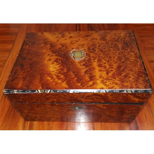 515 - An inlaid burr walnut sewing box with contents