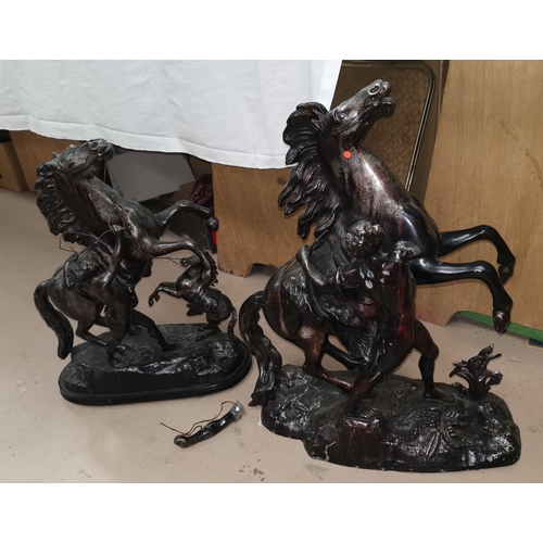 515A - A matched pair of bronzed Marley horses