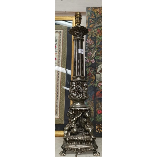 516 - A large classical column table lamp in silvered metal with cherubs in relief, height 22