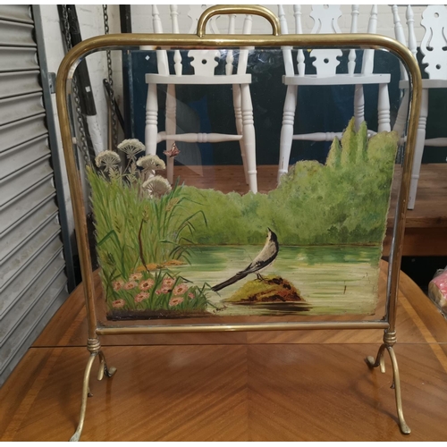 526A - A Victorian brass firescreen with bevelled glass and painted river scene