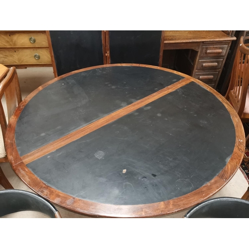 538 - A 20th Century designer Scandinavian rosewood table and chairs, the table a circular extending dinin... 