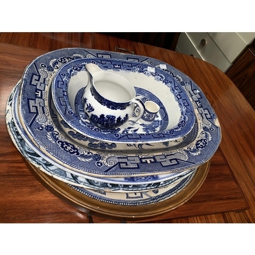 182A - Three 19th century blue & white meat plates; a similar dish and jug; a Willow pattern embroidered tr... 