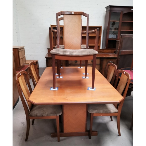672 - A mid 20th century teak G-Plan dining suite comprising of a canted rectangular table, 6 dining chair... 