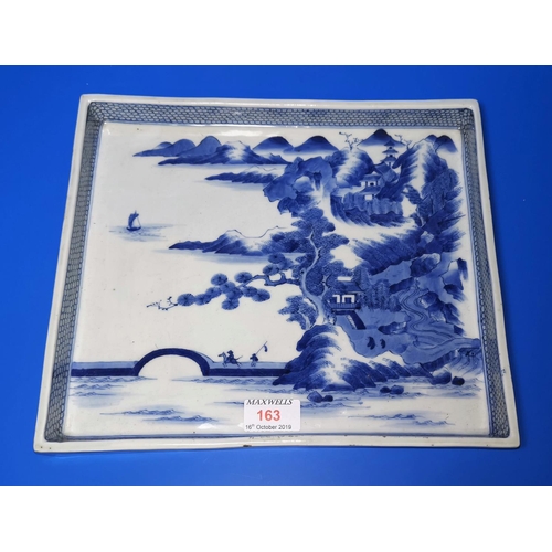 163 - A Chinese porcelain blue and white rectangular tray with mountain landscape and sea decoration, 26cm... 