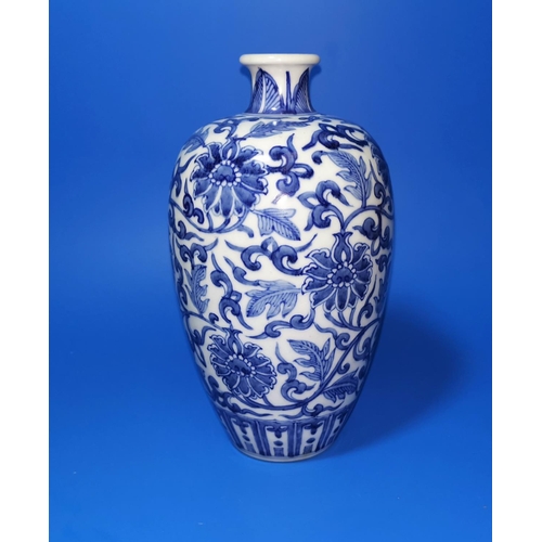163a - A Chinese blue and white ceramic plum shaped vase with floral decoration, ht 20cm