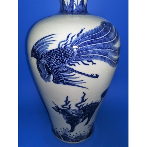 177 - A large Chinese ceramic blue and white plum shape vase decorated with Phoenix and other mystical cre... 