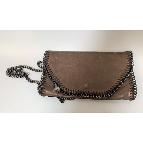 709 - A irridescent brown faux leather shoulder purse with heavy black chain edging and strap in the style... 
