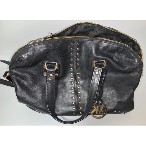 715 - A Michael Kors labelled maroon cross body gilt studded purse; a Michael Kors labelled Selma handbag ... 