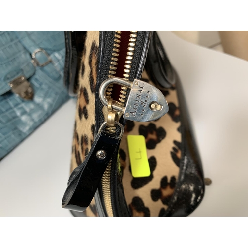 718 - An ASPINAL OF LONDON labelled Hepburn calf hair bag with matching purse and dust bag (worn); 3 handb... 