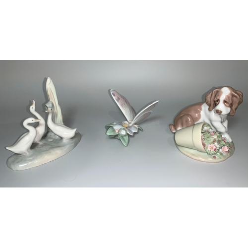 8 - A Lladro group of 3 geese; a Lladro figure of a Spaniel and knocked over plant pot of flowers; a Lla... 