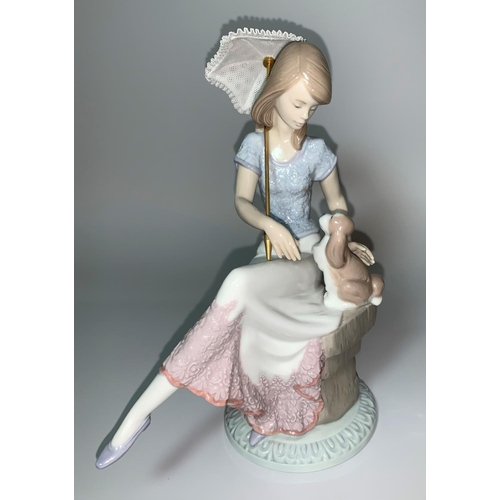 9 - A Lladro figure of a seated girl holding a parasol and a puppy, 5th Anniversary, impressed '7612'