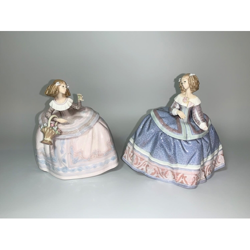 13 - Two Lladro ladies in crinolines, one holding a basket of flowers (a.f.)