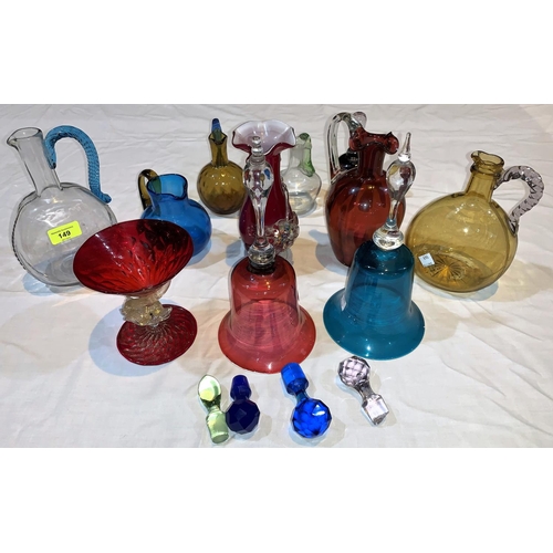 149 - A 19th century clear and blue glass claret jug, another, 2 coloured glass bells etc